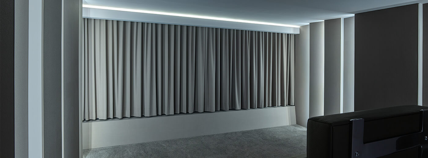 Electrically controlled cinema curtains in the home cinema